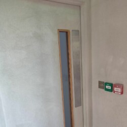 ClaudiCemento microcement on the door and walls by Sobo. Door and Walls