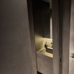 ClaudiCemento microcement dark grey on the floors, walls, ceilings installed by SOBO. Gym