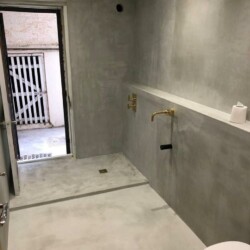ClaudiCemento microcement on the floors, walls, ceilings installed by Lukasz - 07784989756. Bathroom