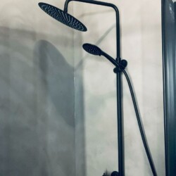 ClaudiCemento microcement deck on the floors, walls, ceilings installed by SOBO. Bathroom