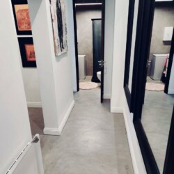 ClaudiCemento microcement deck on the floors installed by SOBO. Residential property