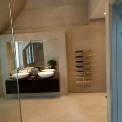 ClaudiCemento microcement on the floors, walls, ceilings installed by SOBO. Bathroom