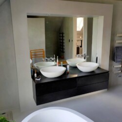 ClaudiCemento microcement on the floors, walls, ceilings installed by SOBO. Bathroom