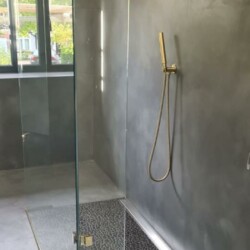 ClaudiCemento microcement deck + Protector DUR epoxy installed by SOBO. Wet Room