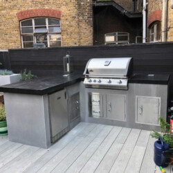 ClaudiCemento microcement installation and garden design by World Land Design. Outdoor Kitchen