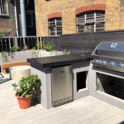 ClaudiCemento microcement installation and garden design by World Land Design. Outdoor Kitchen