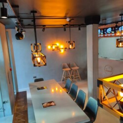 ClaudiCemento microcement deck on the walls and fridge installed by SOBO. Commercial - restaurant