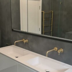 ClaudiCemento microcement deck + Protector DUR epoxy installed by SOBO. Bathroom