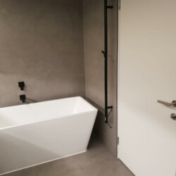 ClaudiCemento Microcement Fine matt finish, medium grey colour Bathroom