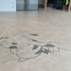 ClaudiCemento microcement deck with stainless steel inlay  installed by SOBO. Commercial - office floor