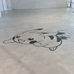 ClaudiCemento microcement deck with stainless steel inlay  installed by SOBO. Commercial - office floor