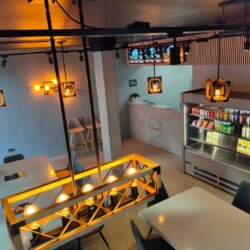 ClaudiCemento microcement deck on the walls and fridge installed by SOBO. Commercial - restaurant